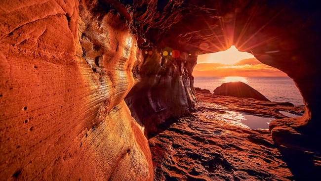 The 40m tunnel carved out of the rock on the headland between Queenscliff and Freshwater beaches. Picture: Destination NSW