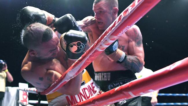 John Wayne Parr forces Anthony Mundine onto the ropes on Saturday night. Picture: AAP