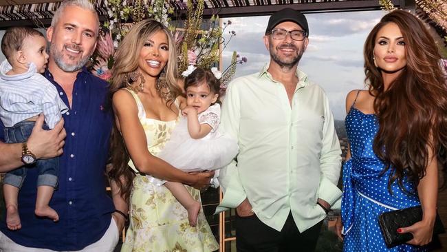 James Clark holding his son Izak, Rebekah Behbahani holding her daughter Storm, billionaire investor Alex Waislitz, and Venus Behbahani -Clark. Picture: Supplied