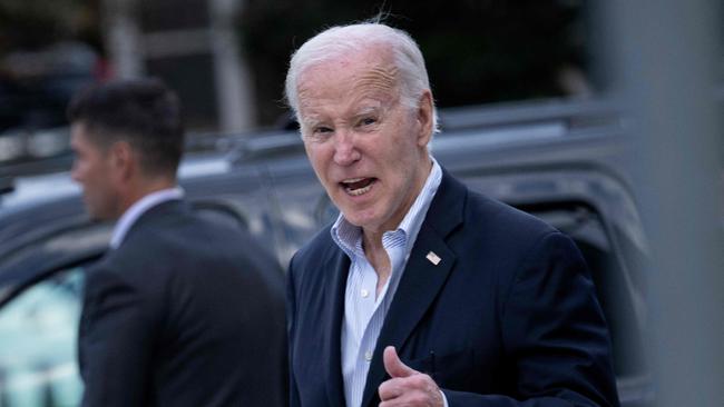 US President Joe Biden gives a thumbs up and says "yes" when asked about progress in a humanitarian pause in the Israel-Hamas conflict.