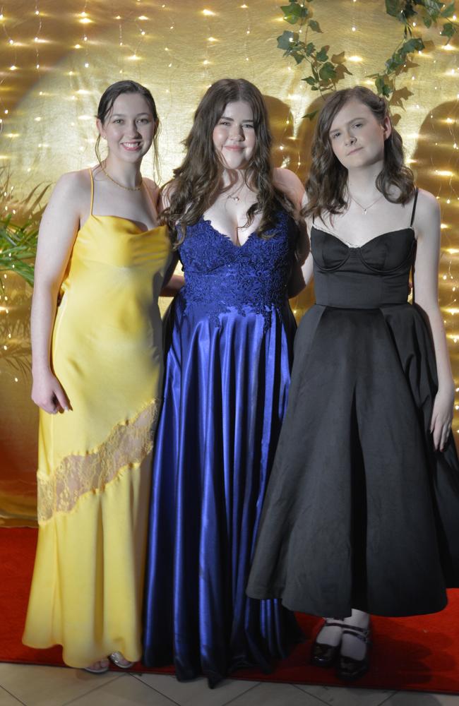 Matilda Briggs, April Pott and Amelie Quirey at the Toowoomba State High School Formal, November 13, 2024.