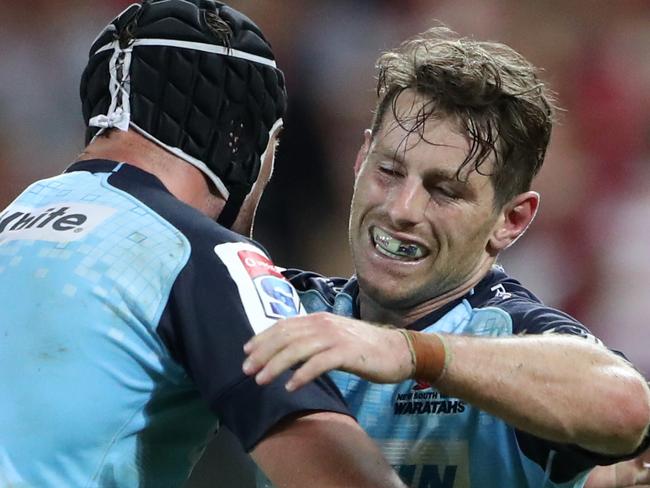 Bernard Foley and Dean Mumm of NSW celebrate winning the Super Rugby game between the Queensland Reds and the NSW Waratahs. Pic Darren England.