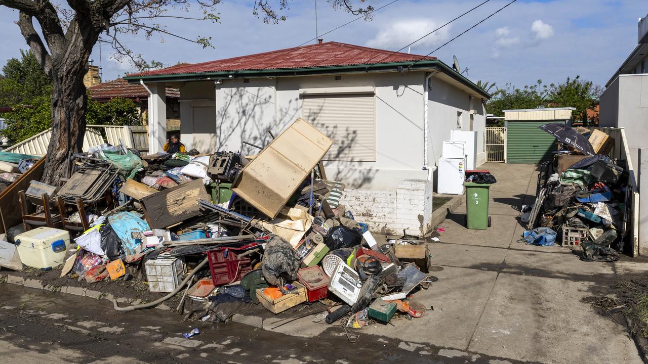 Piles of flood-damaged furniture line Clyde Street in Maribyrnong. Picture: Aaron Francis