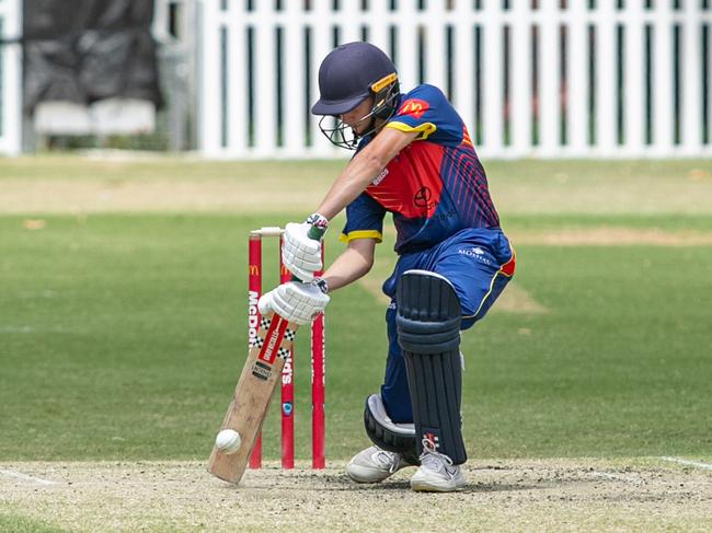 Aidan Kurtis gets one off the middle for Mosman. Pics by Julian Andrews