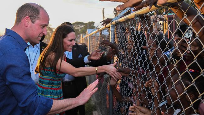 <span id="U731341869893oMD">William and Kate shake hands with their “subjects” during a visit to Trench Town, Jamaica. </span>