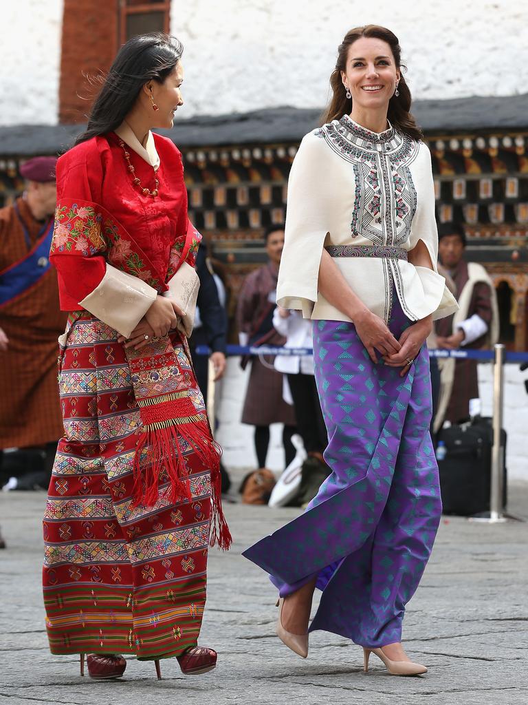 Catherine, Duchess of Cambridge walks with HM Jetsun Pema Wangchuck in front of monks in the Tashichhodzong (fortress) on the first day of a two day visit to Bhutan on the 14th April 2016 in Paro, Bhutan. Picture: Getty