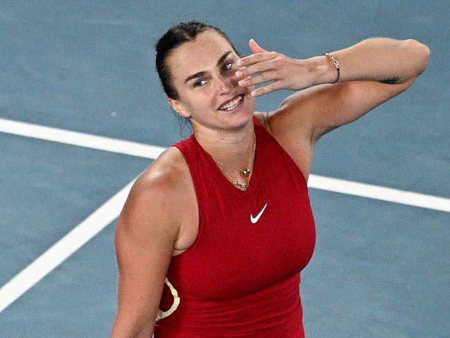 Belarus' Aryna Sabalenka celebrates after victory against USA's Coco Gauff during their women's singles semi-final match on day 12 of the Australian Open tennis tournament in Melbourne on January 25, 2024. (Photo by Anthony WALLACE / AFP) / -- IMAGE RESTRICTED TO EDITORIAL USE - STRICTLY NO COMMERCIAL USE --