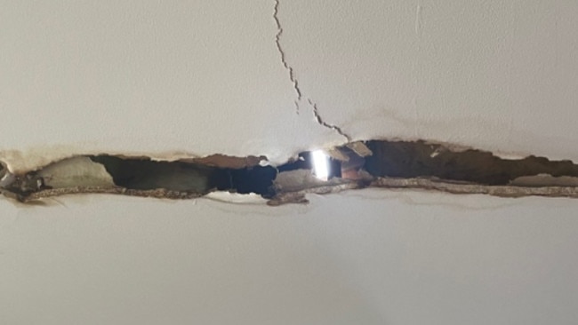 Light seen through a ceiling at the Oxenford home after the Christmas night tornado.