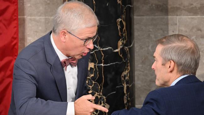 Acting speaker Patrick McHenry, left, confers with Jim Jordan on the floor of the house on Wednesday. Picture: AFP