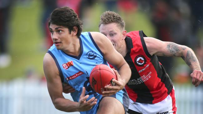 Sturt's Shane McAdam breaks away from West's Errin Wasley-Black in the Double Blues’ win on Saturday. Picture: AAP/Dean Martin.