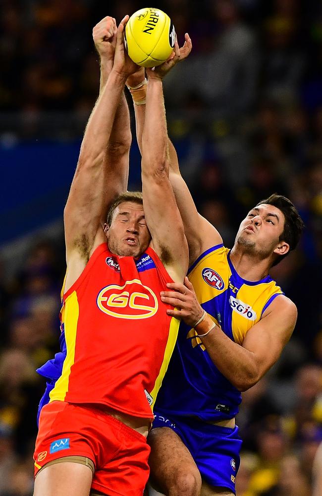 Sam Day takes a strong mark despite the close attention from West Coast’s Tom Barrass in their round 4 clash.