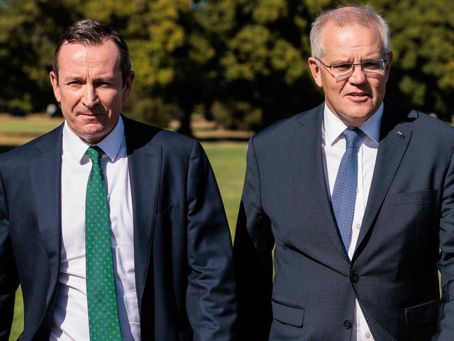 WA Premier Mark McGowan (left) and Prime Minister Scott Morrison are seen arriving for a press conference in Perth, Thursday, March 17, 2022.  (AAP Image/Richard Wainwright) NO ARCHIVING