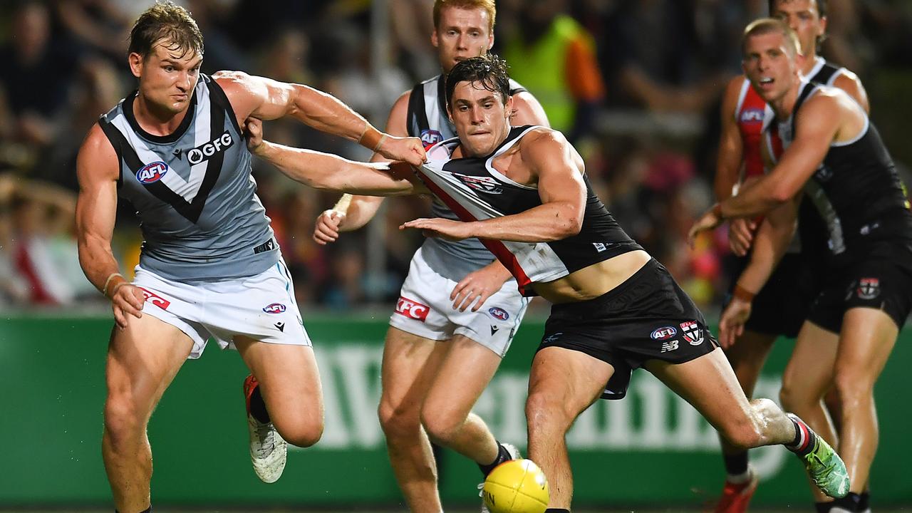 Ollie Wines and Jack Steele compete for the ball in tough conditions in Cairns. Picture: Perez/AFL Photos