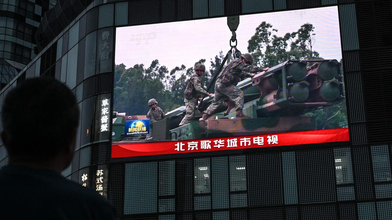 An outdoor screen shows a news coverage of China’s military drills around Taiwan, in Beijing on May 23, 2024. China launched on May 23 what it called "Joint Sword-2024A" exercises, surrounding Taiwan with warplanes and navy ships and vowing "stern punishment" of separatist forces on the island. (Photo by Jade Gao / AFP)