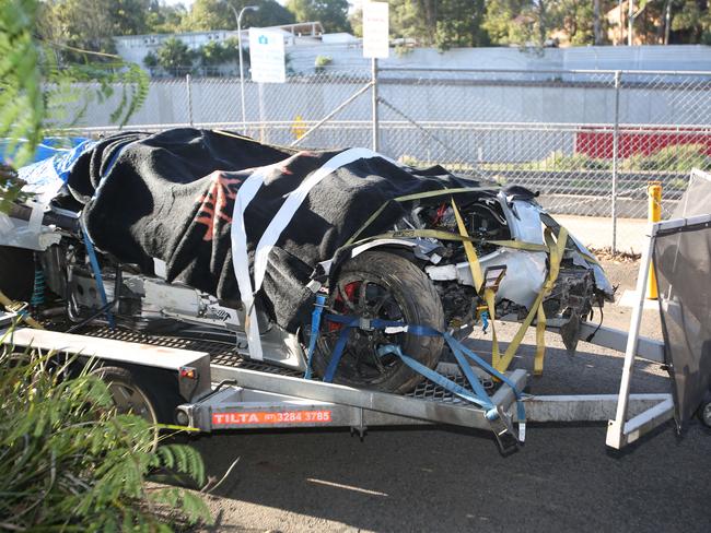 Grant Denyer's smashed Lotus Exige Sport 350 rally car is trucked back to Sydney. Picture: Bob Barker