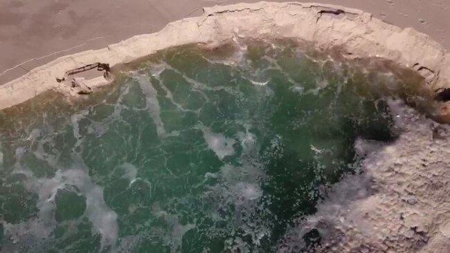 Breaking up: the sand falls into the Rainbow Channel. Picture: Chris Poulsen