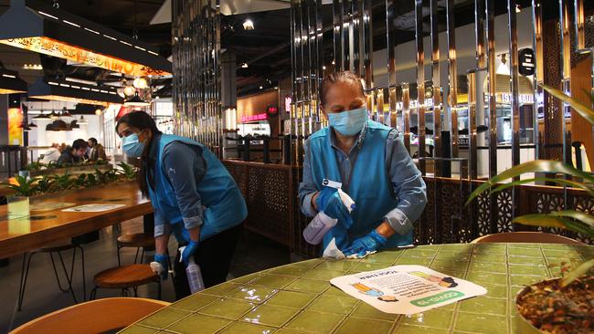 Members of the presentation and hygiene team at Mirvac’s Broadway Shopping Centre. Picture: Lisa Maree Williams/Getty Images.