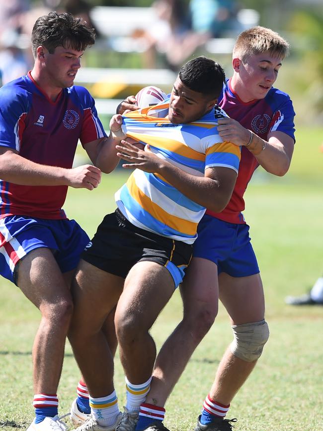 Boys Rugby League State Championship held at Northern Division, Brothers Leagues ground, Townsville. 16-18 years. Peninsula (stripe) v Darling Downs (blue/purple). Jason Hastie of Mareeba SHS