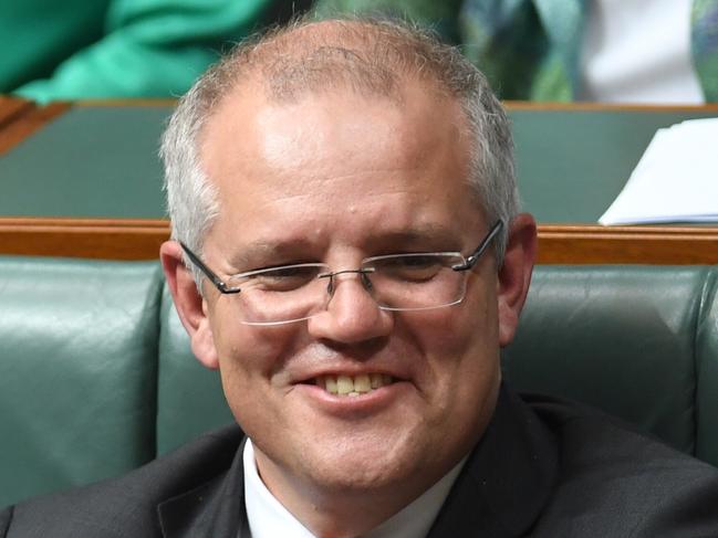 Australia's Treasurer Scott Morrison (right) and the Leader of the House Christopher Pyne react during House of Representatives Question Time at Parliament House in Canberra, Thursday, March 23, 2017. (AAP Image/Lukas Coch) NO ARCHIVING