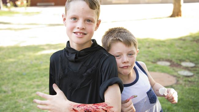 ( From left ) 9 yo Cooper Johnson and 7 yo Hunter Johnson celebrate Hunter's birthday. Halloween family fun event at the Toowoomba Library. Picture: Nev Madsen. Saturday, 26th Oct, 2019.