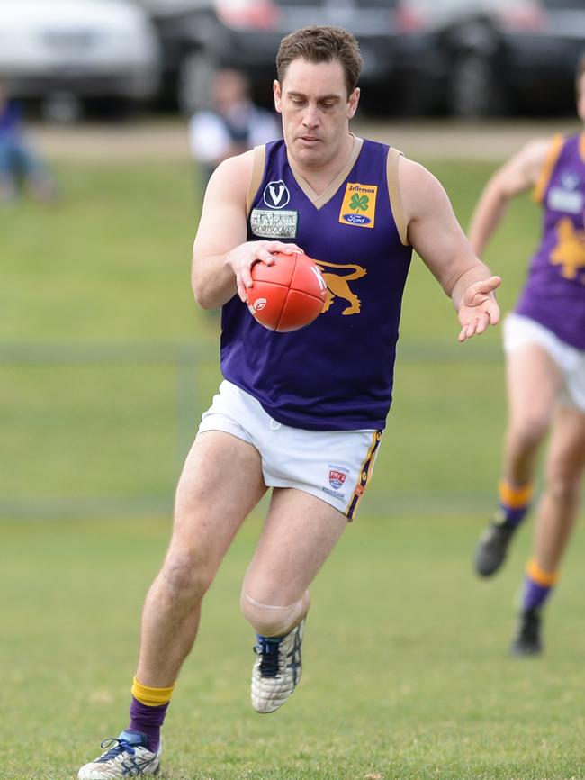 Nick Ries of Old Collegians sends his side forward in last year’s grand final. Picture: Susan Windmiller