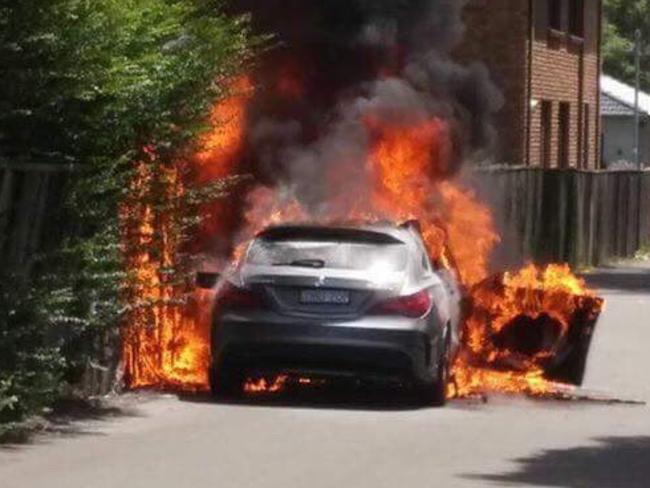 A car on fire in Chandler St, Kogarah, believed linked to the murder. Picture: Claude Nunes