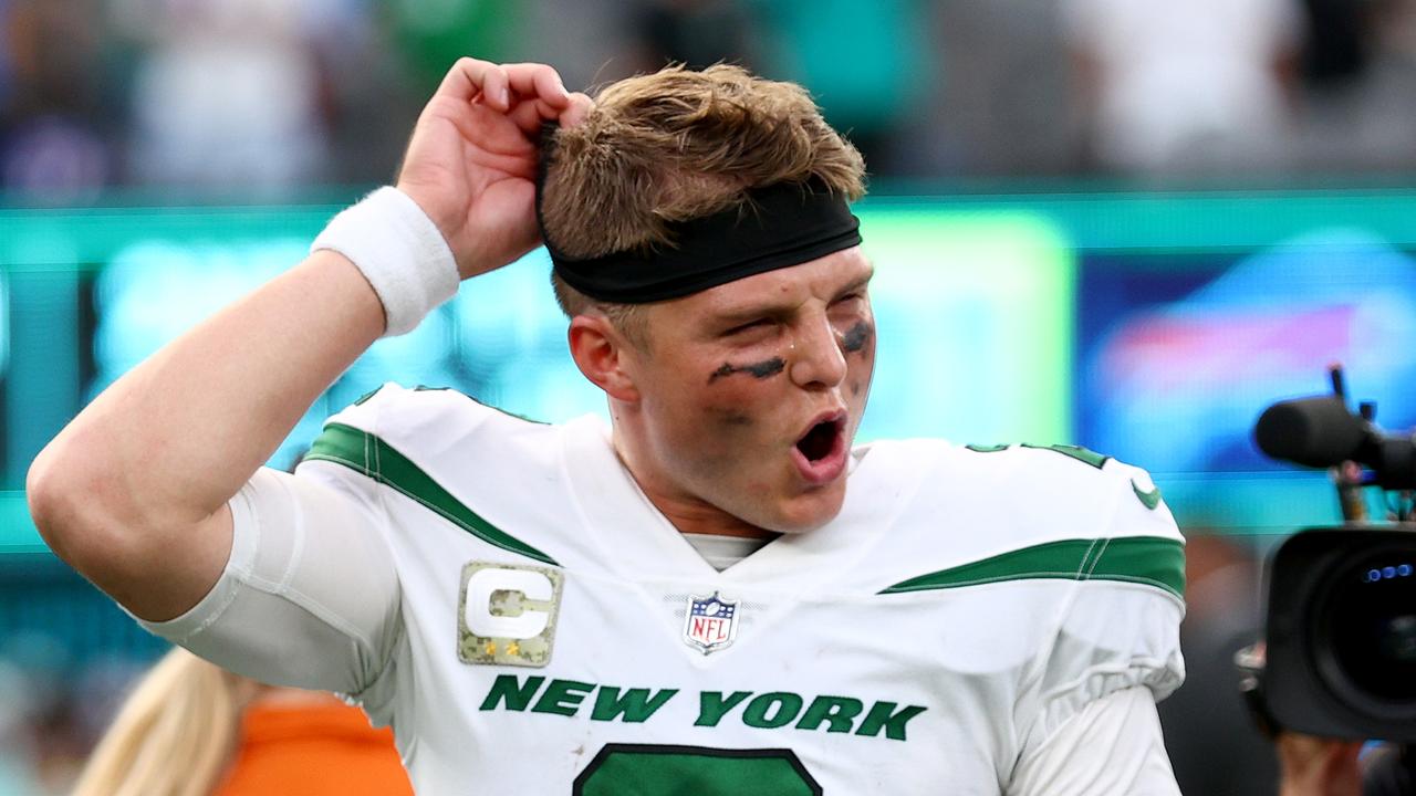 EAST RUTHERFORD, NEW JERSEY - NOVEMBER 06: Zach Wilson #2 of the New York Jets celebrates as he walks off the field after beating the Buffalo Bills 20-17 at MetLife Stadium on November 06, 2022 in East Rutherford, New Jersey. (Photo by Elsa/Getty Images)