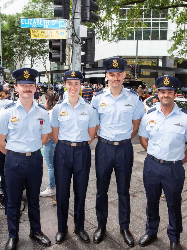 Thousands of people have braved the rain to gather in Brisbane for Anzac Day services. Picture: Grace Kessels