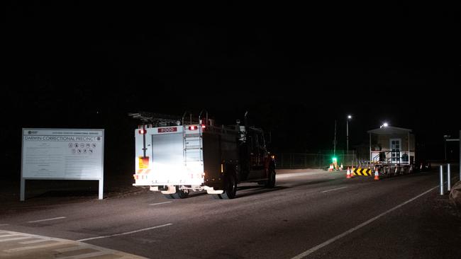 Emergency service vehicles arrive at the Darwin Correctional Facility after prisoners were reported on the roof after a mass breakout. Picture: Che Chorley