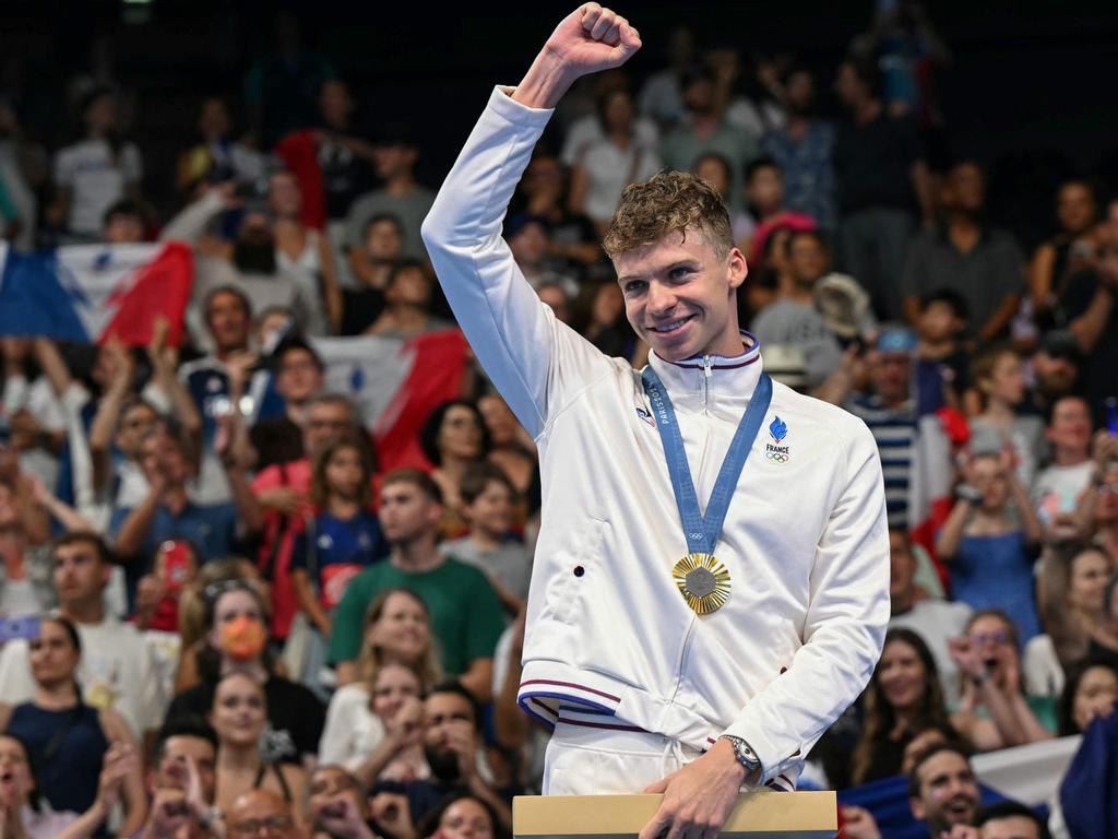 France's hometown hero Leon Marchand after his double gold medal night in the pool. Picture: Jonathan NACKSTRAND / AFP