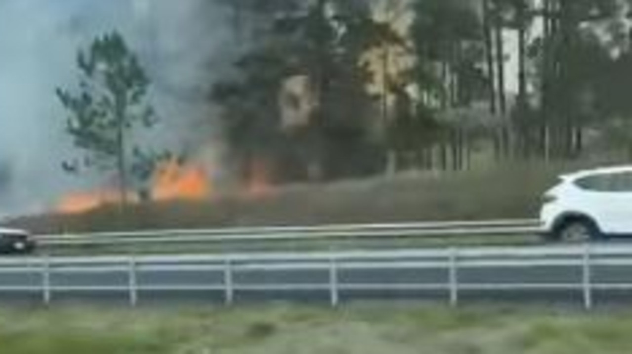 Fire crews are battling a grass fire next to the Bruce Hwy at the southern end of the Sunshine Coast. Picture: Hev Farmer