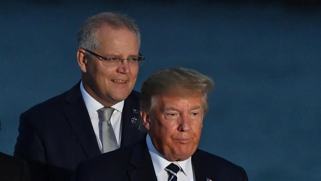 U.S. President Donald Trump and Australia's Prime Minister Scott Morrison at the family photograph during the G7 Summit in the town of Biarritz, 800km south of Paris in France, Sunday, August 25, 2019.  (AAP Image/Mick Tsikas) NO ARCHIVING