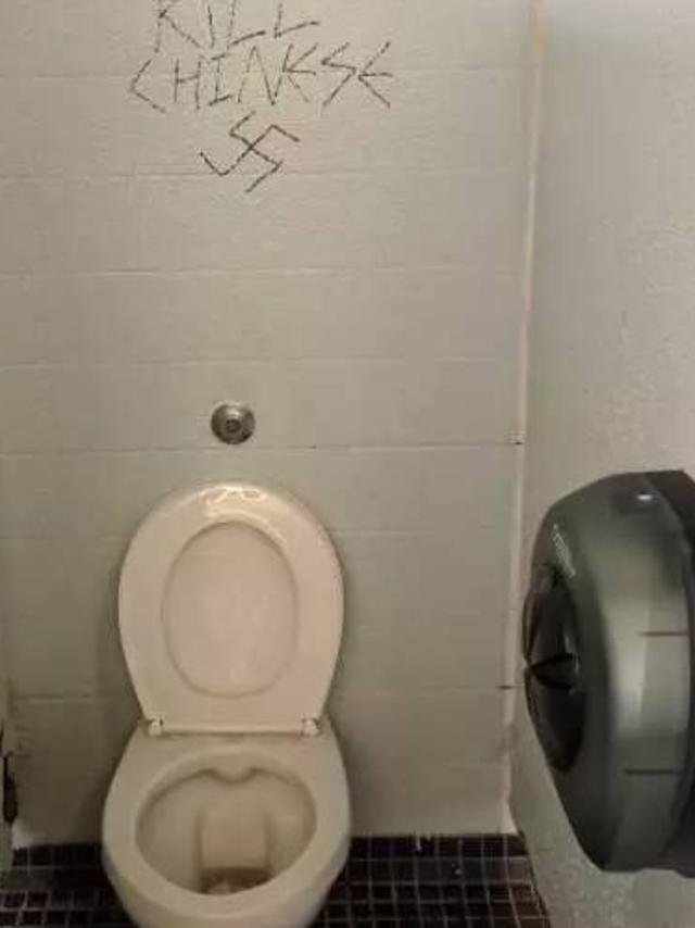 Anti-Chinese graffiti defaces a toilet wall at Sydney university.