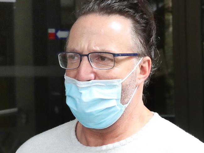 MELBOURNE, AUSTRALIA - NewsWire Photos, MARCH 30, 2022. (ID CONFIRMED WITH JOURNO) A former Western Bulldogs AFL doctor Richard Vucinic, leaves the Melbourne Magistrate court. Picture: NCA NewsWire / David Crosling