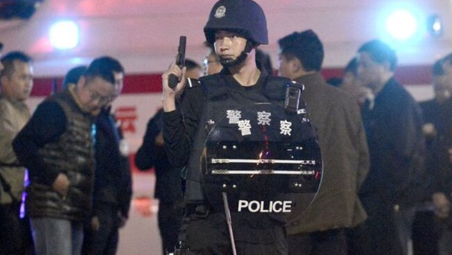 Chinese police in the Yunnan province capital of Kunming (above), where alleged mass murderer Yang Qingpei fled to following the killings Picture: AFP