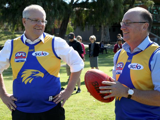 Prime Minister Scott Morrison (left) and Steve Irons, MP for Swan are seen during a visit to Clontarf Aboriginal College in Perth on Tuesday, October 2, 2018. (AAP Image/Richard Wainwright) NO ARCHIVING
