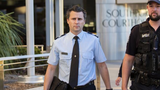 Forensic crash investigator Senior Constable Steven Cornish leaves Southport Courthouse after telling the inquest the “potential” was always there for a raft to flip on the Thunder River Rapids ride. Picture: AAP/Glenn Hunt