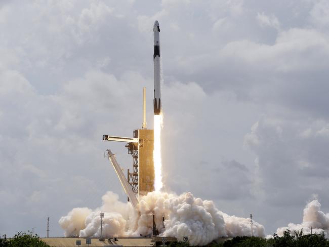 NASA astronauts Doug Hurley and Bob Behnken in the Crew Dragon capsule lift off from Cape Canaveral on Saturday. Picture: AP / David J. Phillip