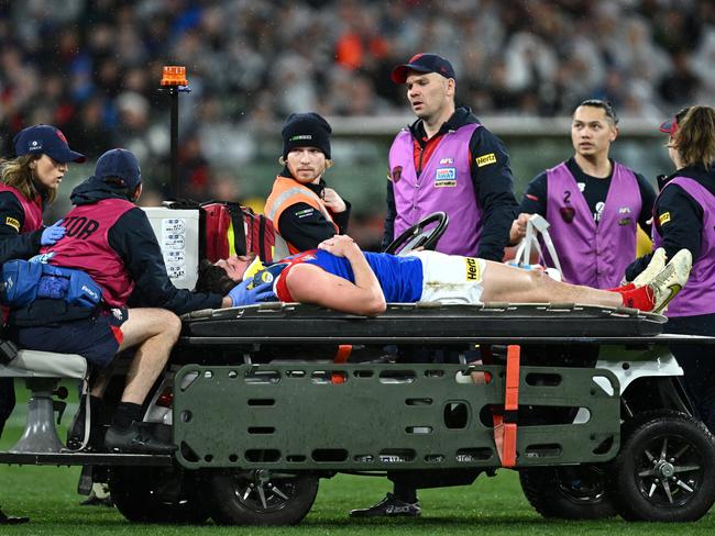 Angus Brayshaw is taken from the field following the incident. Picture: Quinn Rooney/Getty Images