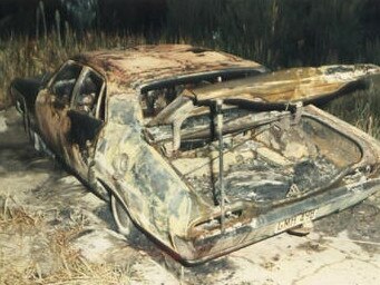 Never before seen crime scene photos pertaining to the murder of racehorse trainer George Brown in 1984. The burnt out Ford Falcon that Brown was found inside of at Bulli Tops on April 2, 1984.