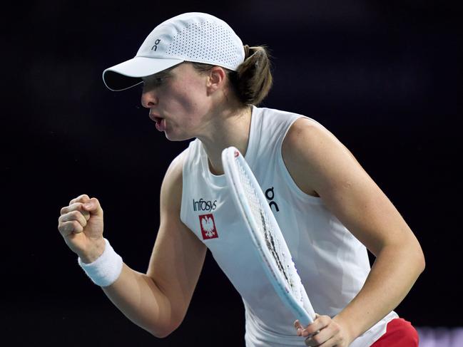 MALAGA, SPAIN - NOVEMBER 18: Iga Swiatek of Team Poland celebrates a point in her singles match against Jasmine Paolini of Team Italy in the Semi-Final tie between Poland and Italy during the Billie Jean King Cup Finals at Palacio de Deportes Jose Maria Martin Carpena on November 18, 2024 in Malaga, Spain. (Photo by Angel Martinez/Getty Images for ITF)