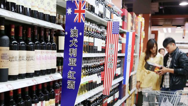 Chinese customers shop for wine imported from Australia, the United States and France at a supermarket in Xuchang city. China was once a $1.2bn market for Australian winemakers.