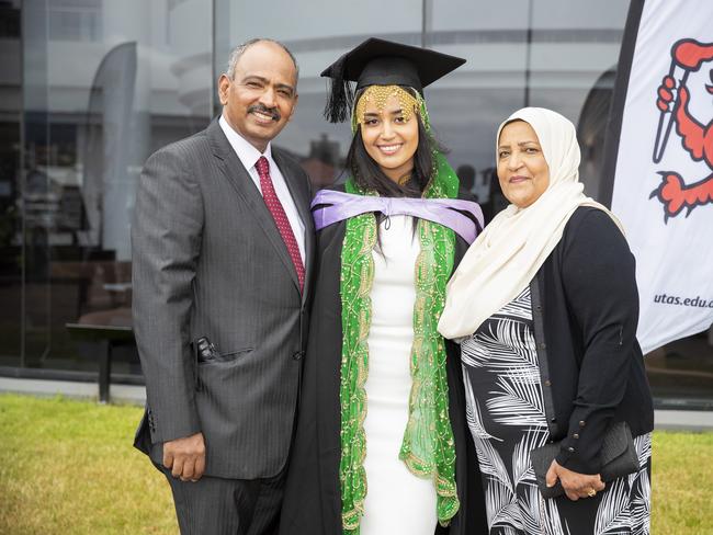 Satra Yusuf (centre) with Jamal and Rumia Yusuf. UTAS graduations. School of College of Health and Medicine Graduate Research. Picture: RICHARD JUPE
