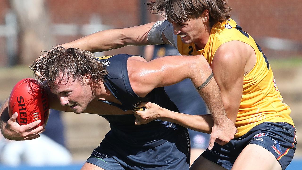 Luke Pedlar fights off a Luke Nankervis during the Crows’ internal trial. Picture: Sarah Reed / AFC