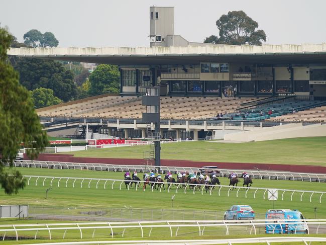 A general view is seen during race 6 at Sandown racecourse as empty seats are seen in the grandstand due to the stage 3 lockdown because of the covid-19 crisis in Melbourne, Wednesday, April 1, 2020. (AAP Image/Michael Dodge) NO ARCHIVING