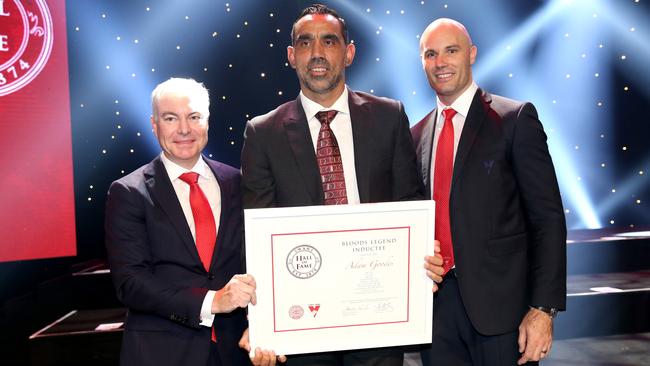 Sydney chairman Andrew Pridham and CEO Tom Harley induct Adam Goodes as a Sydney legend. Picture: Damian Shaw