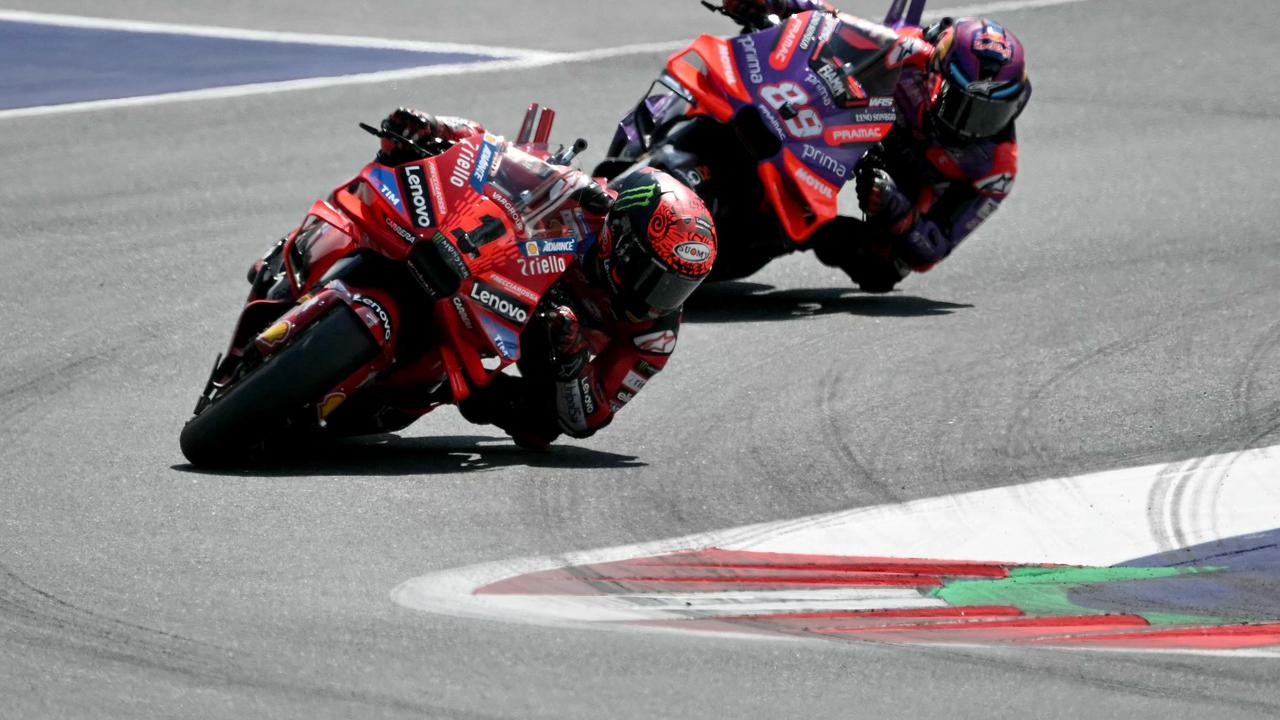 Ducati Lenovo Team's Italian rider Francesco Bagnaia (L) and Prima Pramac Racing's Spanish rider Jorge Martin compete in the Austrian MotoGP race at the Red Bull Ring in Spielberg, Austria on August 18, 2024. (Photo by Jure Makovec / AFP)