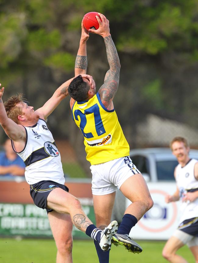 Mornington Peninsula Nepean Football League’s Aaron Edwards marks at full stretch in front of Northern's Ned Mckeown last year. Picture: David Trend