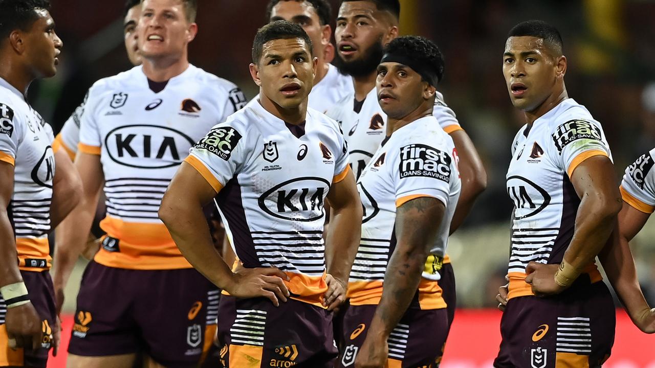 Dejected Broncos players face the axe.