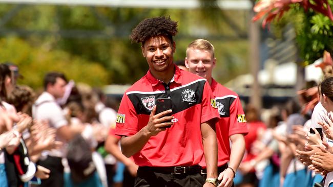 Ragarive Wavik leads his Kirwan SHS teammates through a guard of honour after the school made the national final. Picture: Alix Sweeney